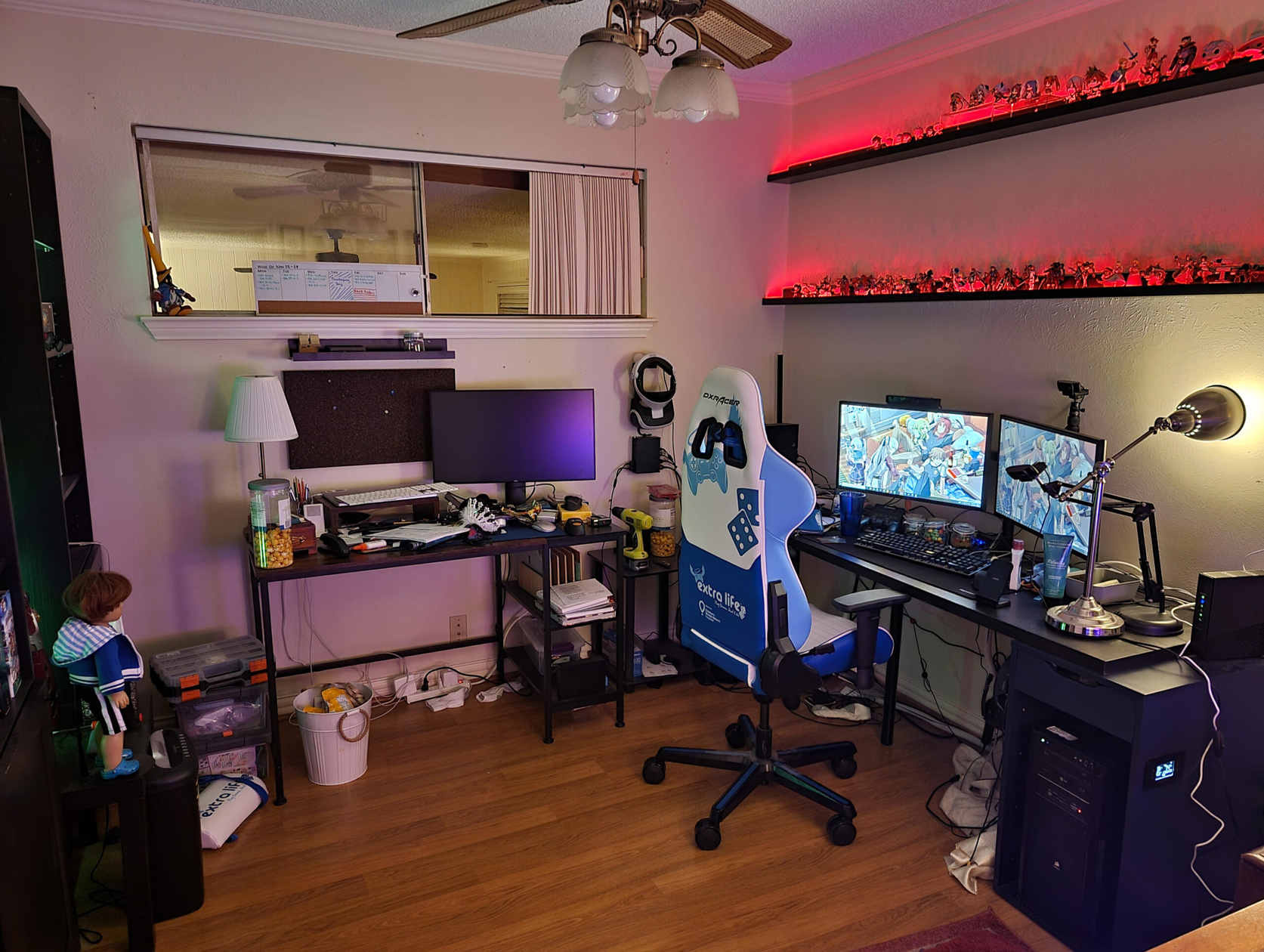 Facing the two desks.